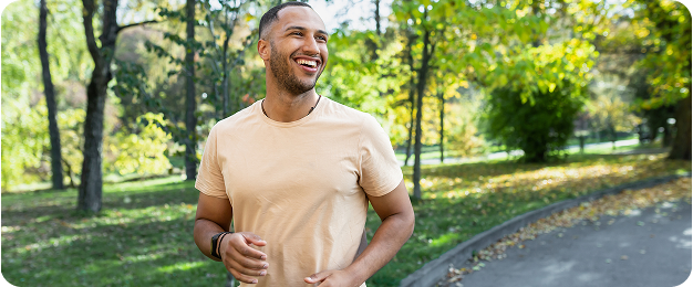 a person who is running and smiles