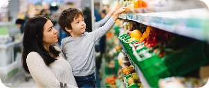 a person and a child in a grocery store