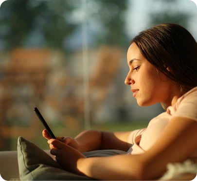 a person who is looking in to their phone
