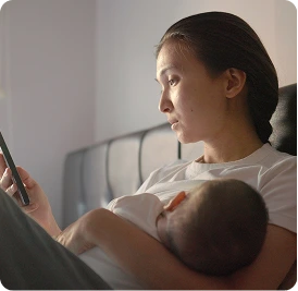 a person holding a baby in their arms