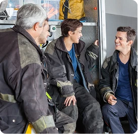 fire fighter sitting together and smiling