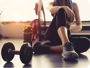 a person that is sitting and resting after a workout
